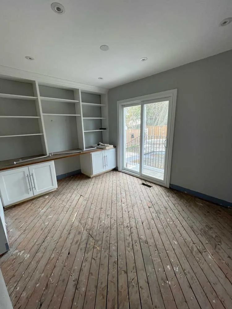 Same room with the hardwood removed down to the subfloor