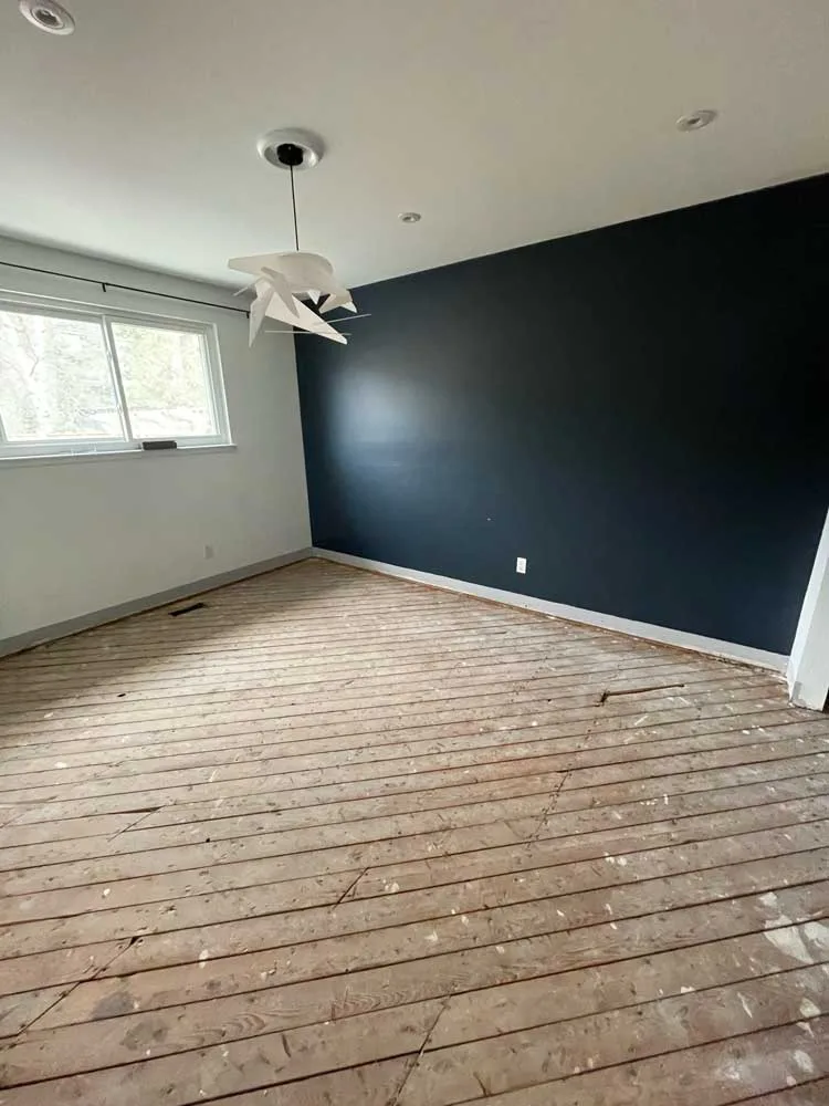 Same room with the hardwood torn out down to the subfloor